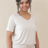 Model wearing the Women’s Relaxed Fit V-Neck in Oat paired with Oat Lounge Pants