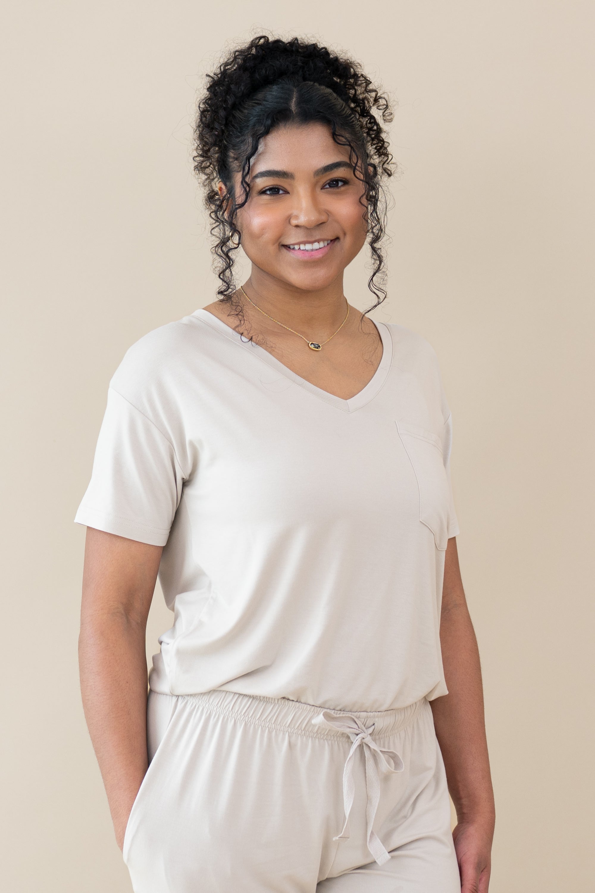 Model wearing the Women’s Relaxed Fit V-Neck in Oat paired with Oat Lounge Pants
