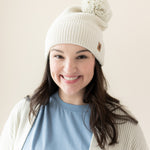 Woman modeling Chunky Knit Pom Beanie in Oat