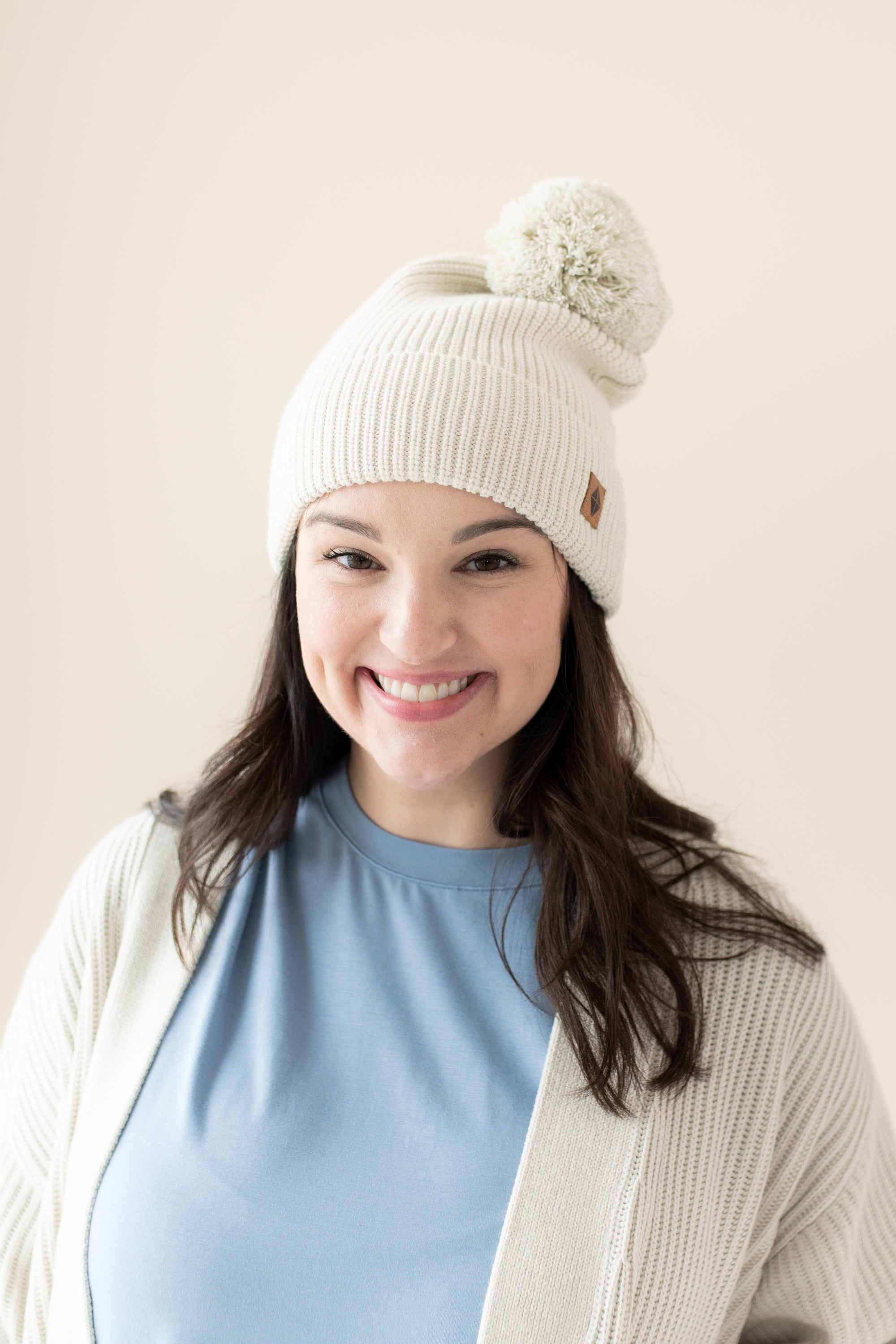Woman modeling Chunky Knit Pom Beanie in Oat