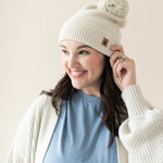 Woman modeling Chunky Knit Pom Beanie in Oat side view