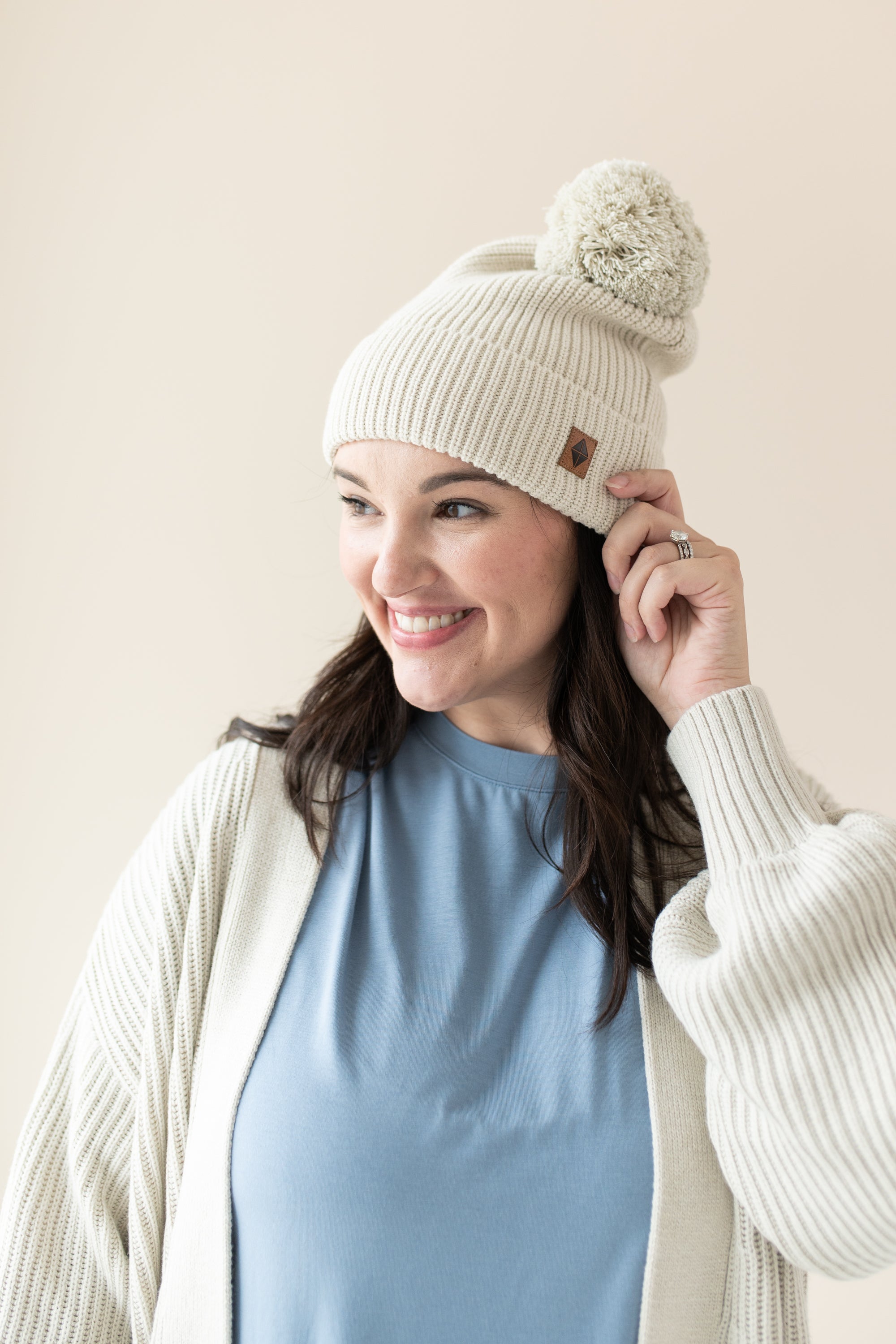 Woman modeling Chunky Knit Pom Beanie in Oat side view