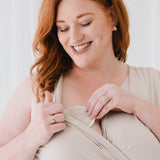 Model putting in Nursing Pads in Oat
