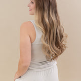Female modeling the back of the Women’s Tank Set in Oat