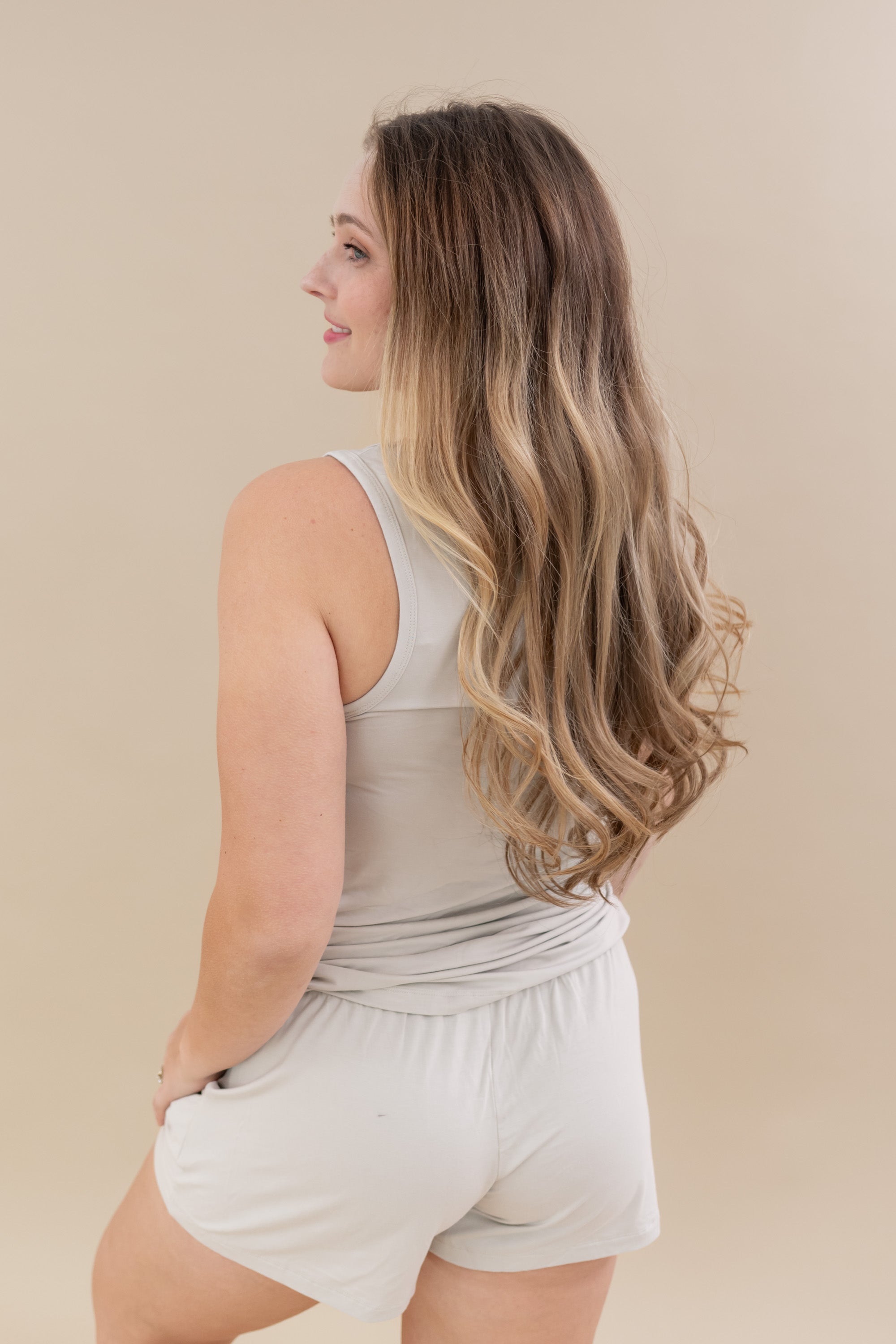 Female modeling the back of the Women’s Tank Set in Oat