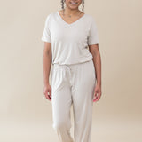 Model wearing the Women's Lounge Pants in Oat paired with an Oat V-Neck