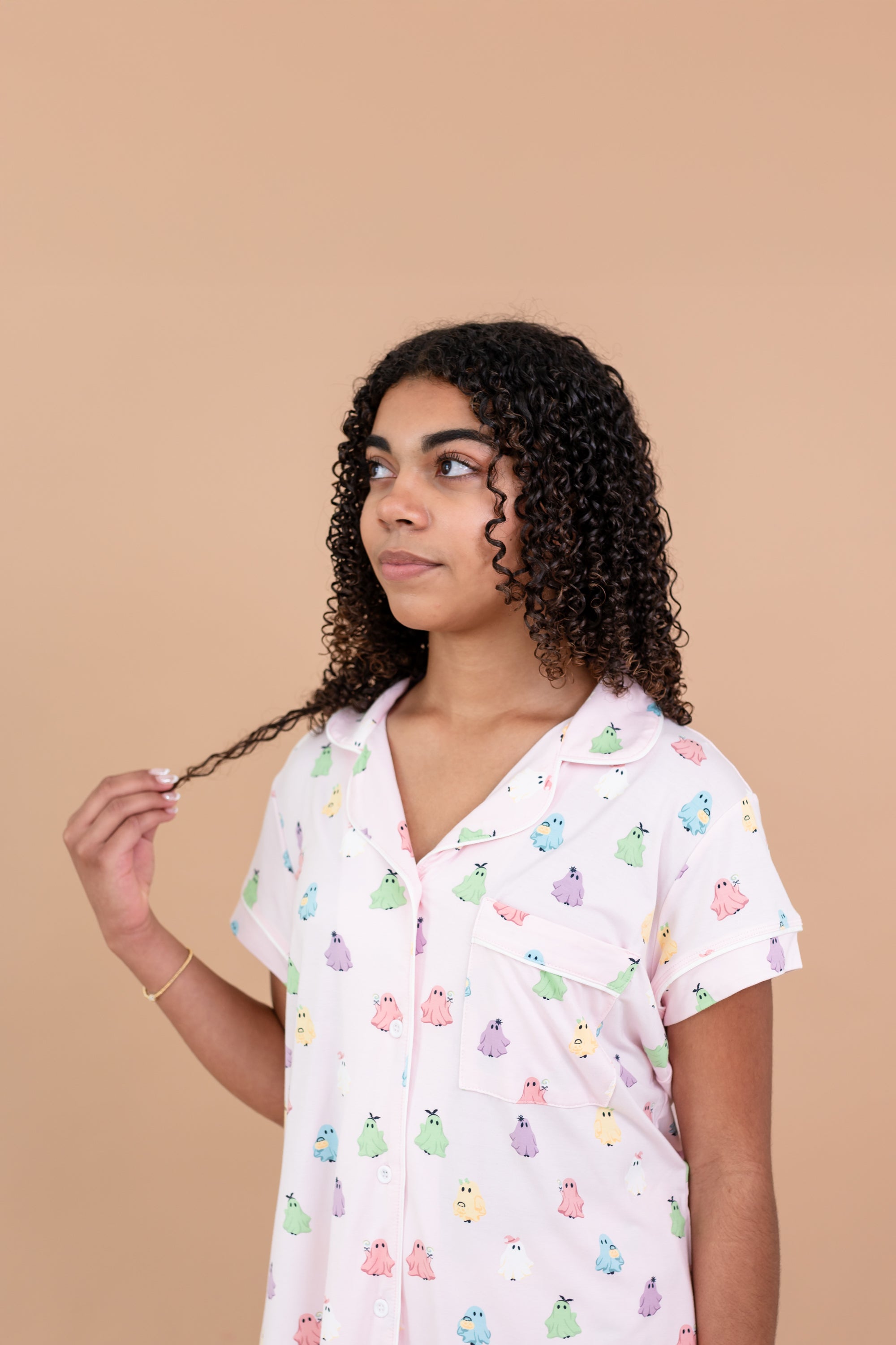 Model looking to the side and close up of the top from the Short Sleeve Pajama Set in Pastel Ghost