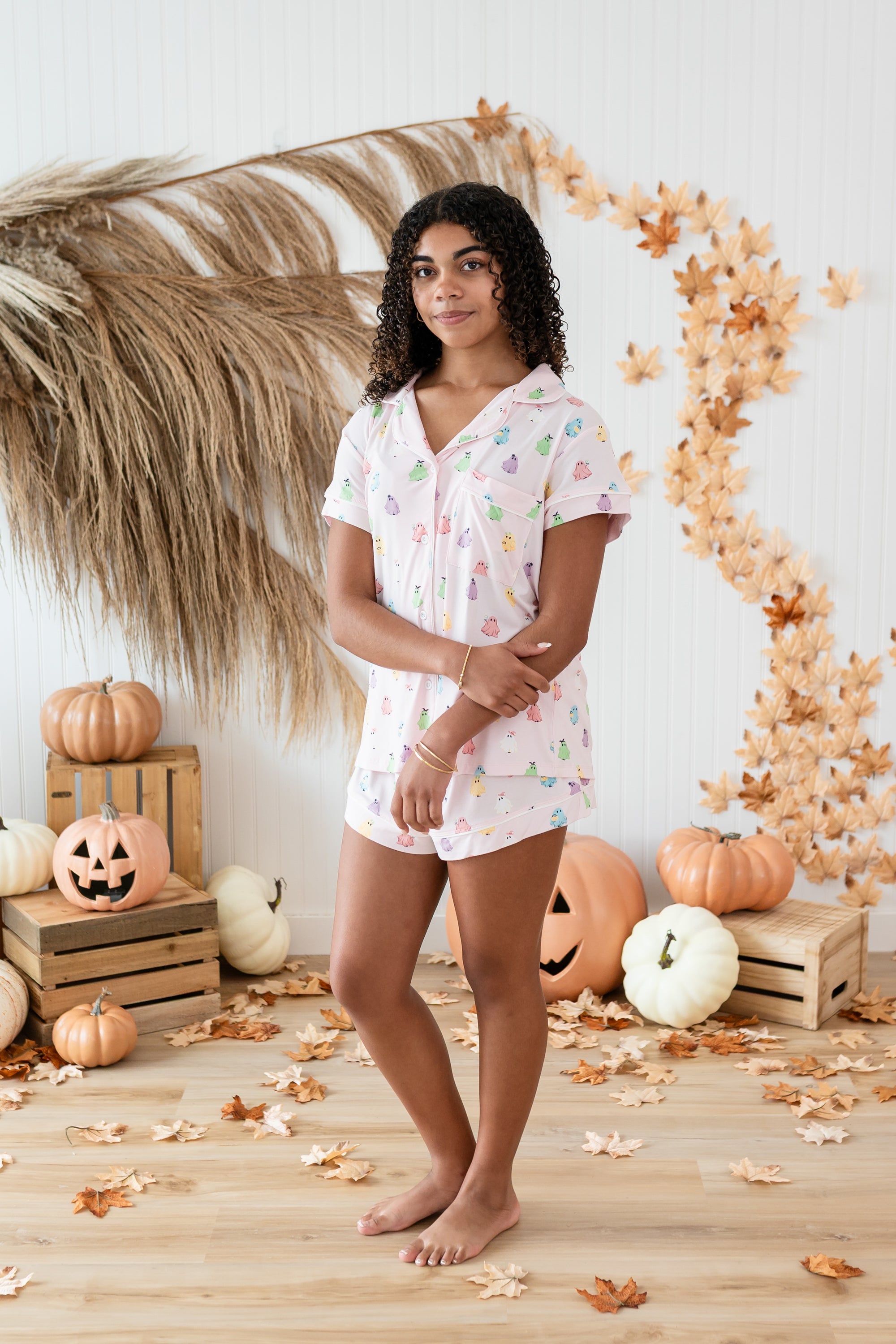 Model in -front o a fall back drop while wearing the Kyte Short Sleeve Pajama Set in Pastel Ghost