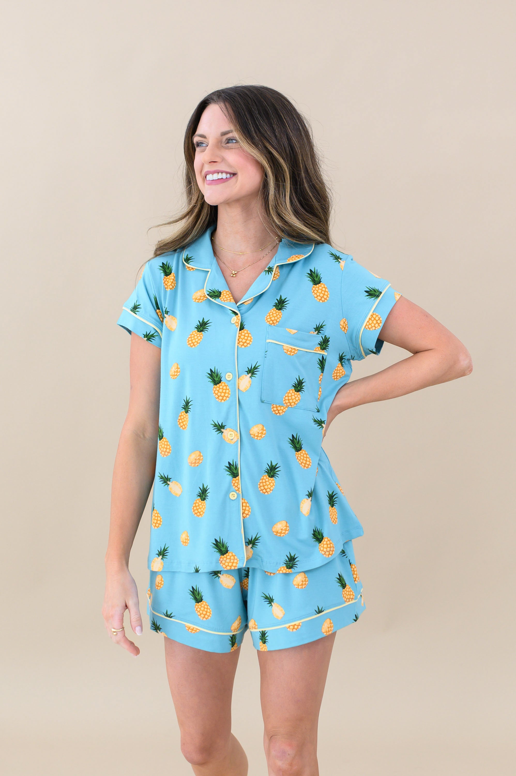 Model wearing Women’s Short Sleeve Pajama Set in Pineapple with hand on hip