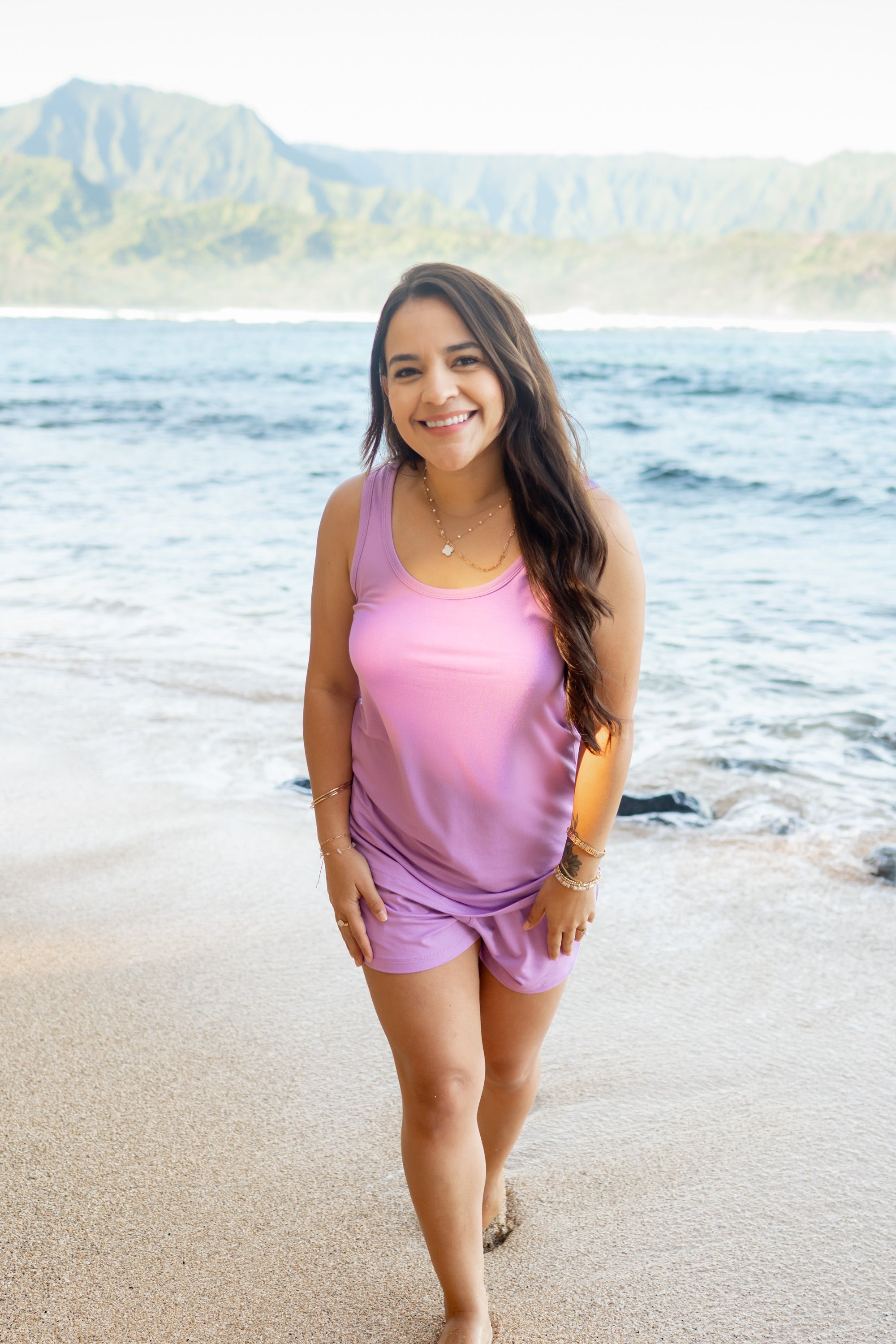 Female model in the sand at the beach wearing Women’s Tank Set in Poi