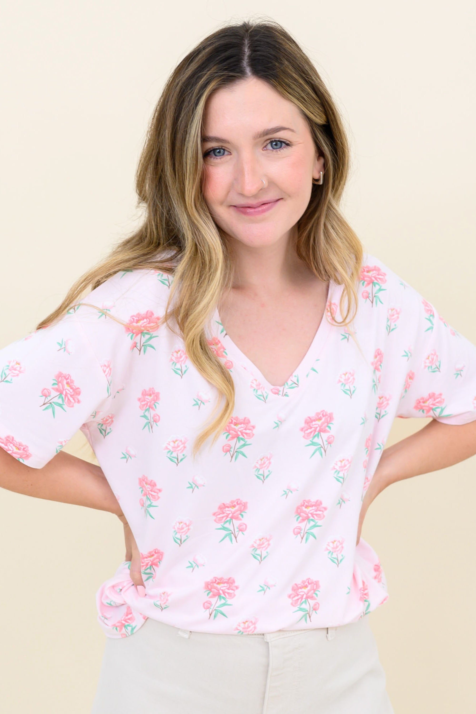 Woman modeling Women's Relaxed Fit V-Neck in Sakura Peony with hands on hips