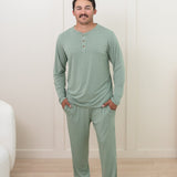 Man modeling Men's Lounge Pants in Thyme with matching henley tee
