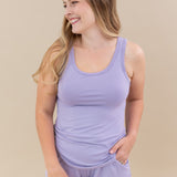 Smiling model wearing the Women’s Tank Set in Taro