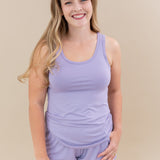 Female model wearing the Women’s Tank Set in Taro