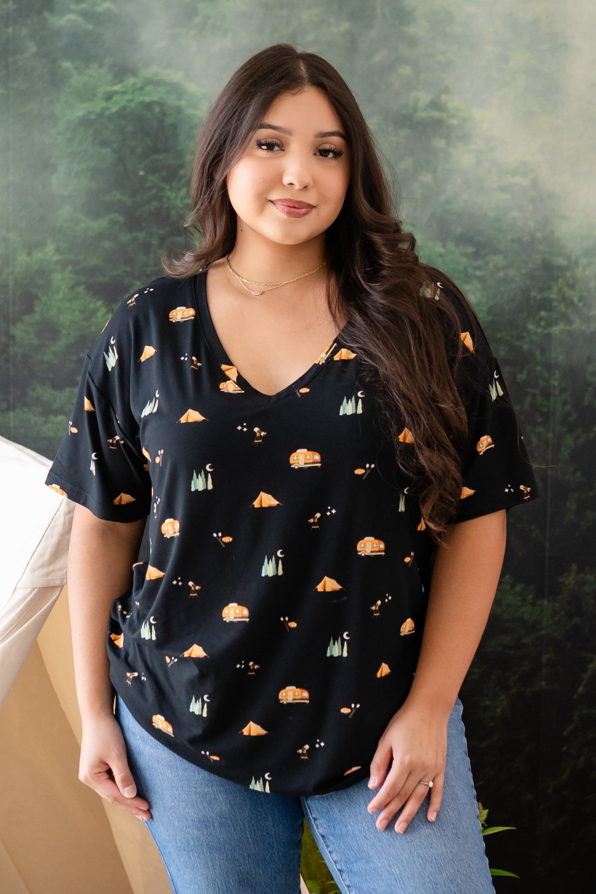 Woman modeling Women's Relaxed Fit V-Neck in Under the Stars with tree mural behind