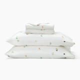 Stack of the Kyte Sateen Sheet Set in Wildflower