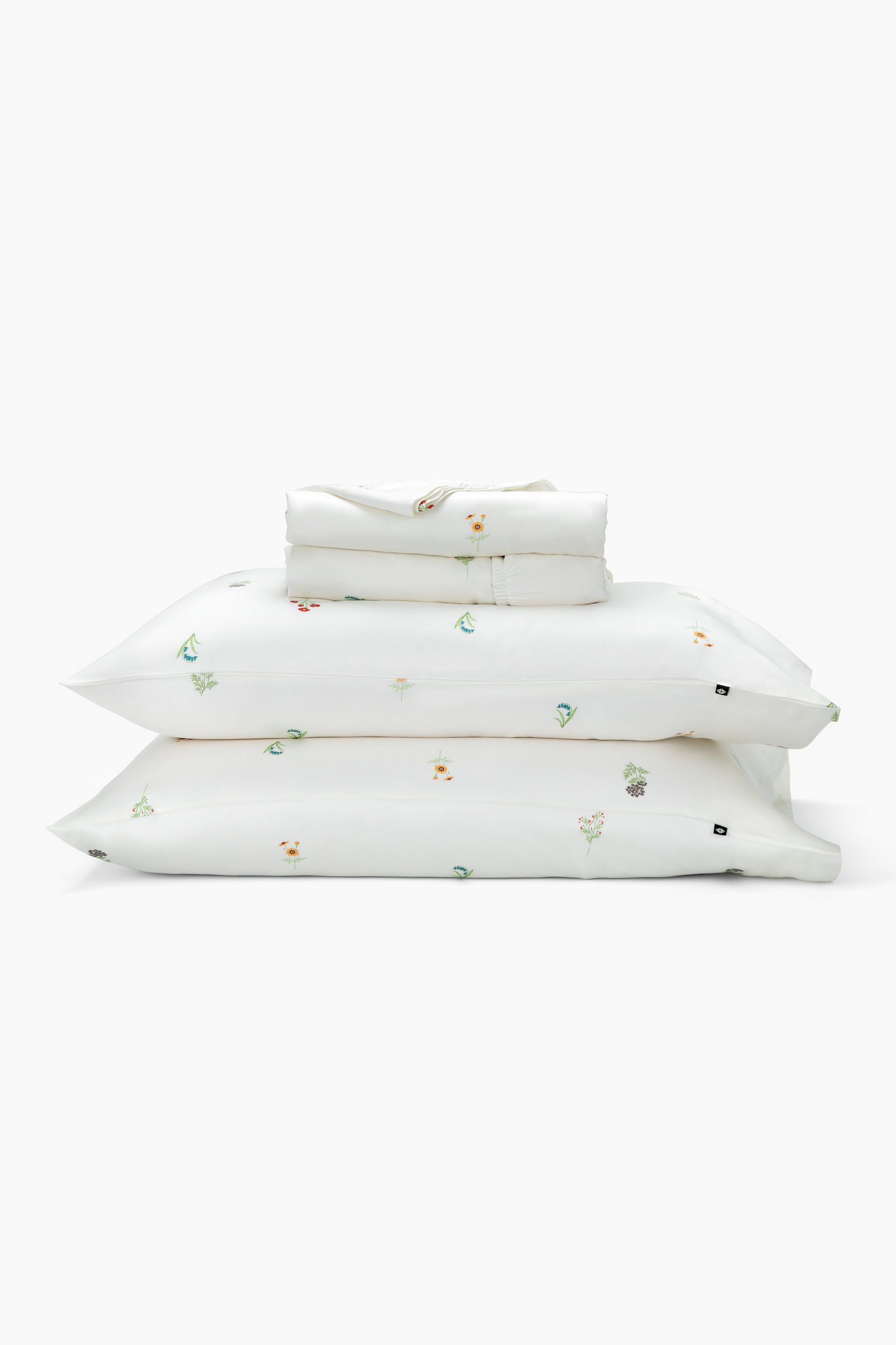 Stack of the Kyte Sateen Sheet Set in Wildflower