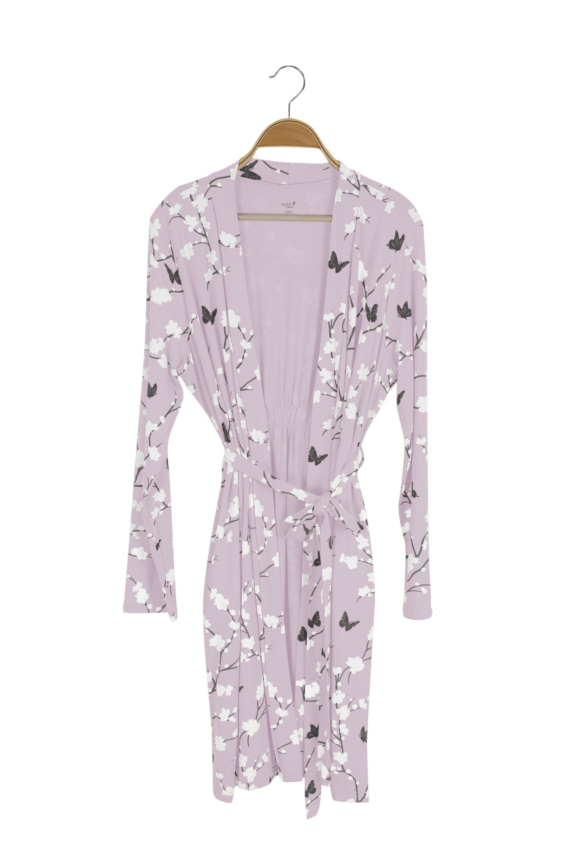 Purple robe with butterfly and floral pattern on a hanger against a white background