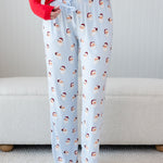 Women's Lounge Pants in Vintage Santa shown on a female model