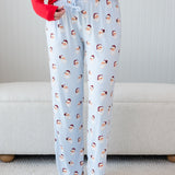 Women's Lounge Pants in Vintage Santa shown on a female model