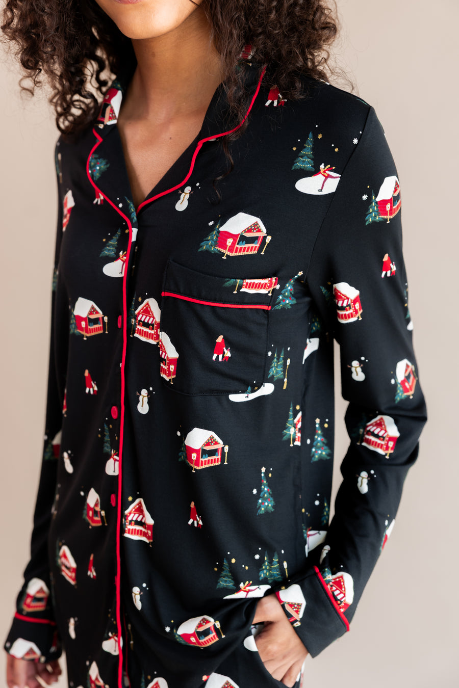 Womans top half with her hand in her pajama pocket in winter wonderland long sleeve pajama set