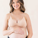 Pregnant woman wearing Kyte Baby's Women's Nursing Bra in Chai