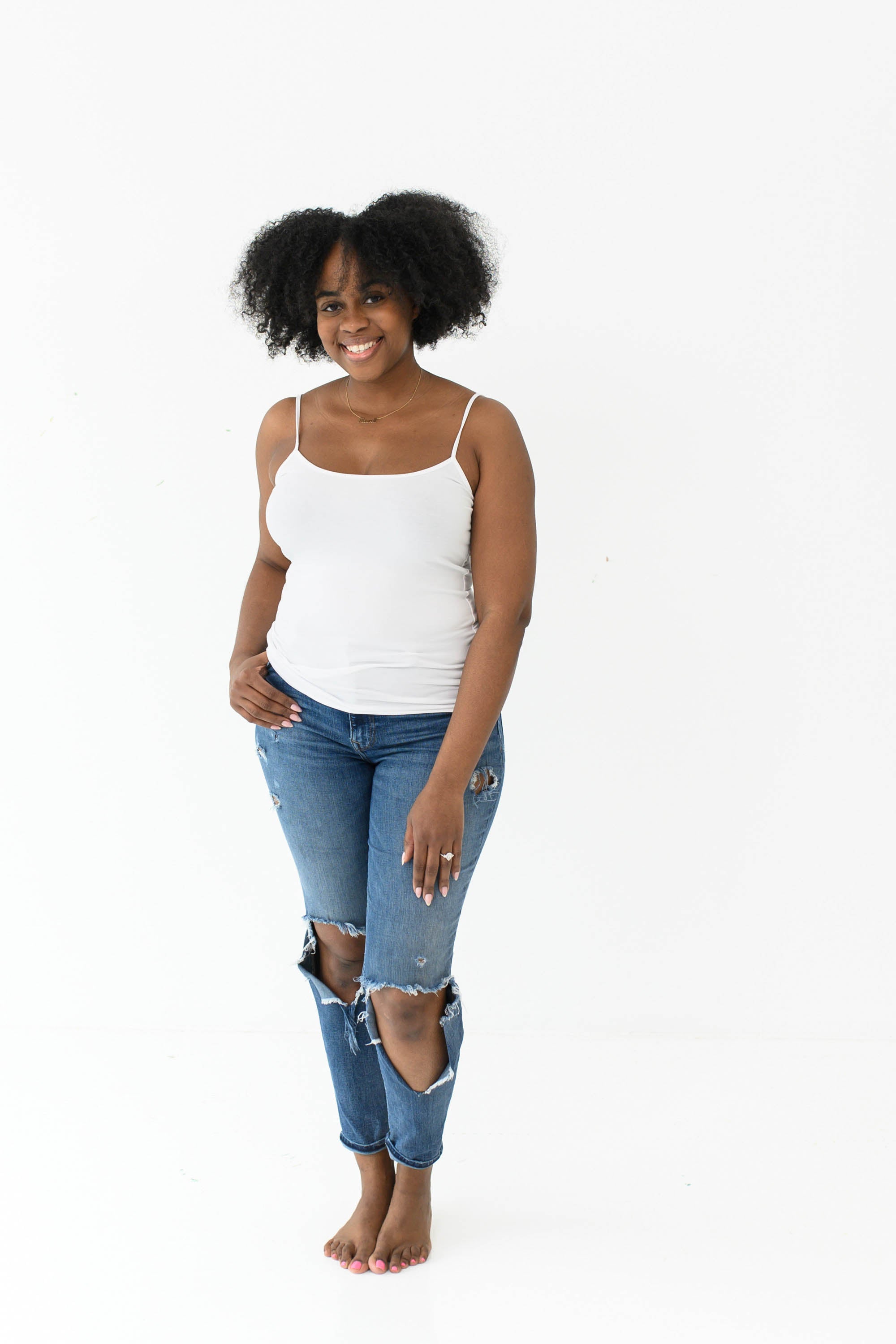 Model in Kyte Baby's Women’s Camisole in Snow and jeans
