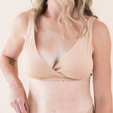 Close up of model wearing Women's Cross Front Bralette in Chai and Women's Midi Brief in Chai