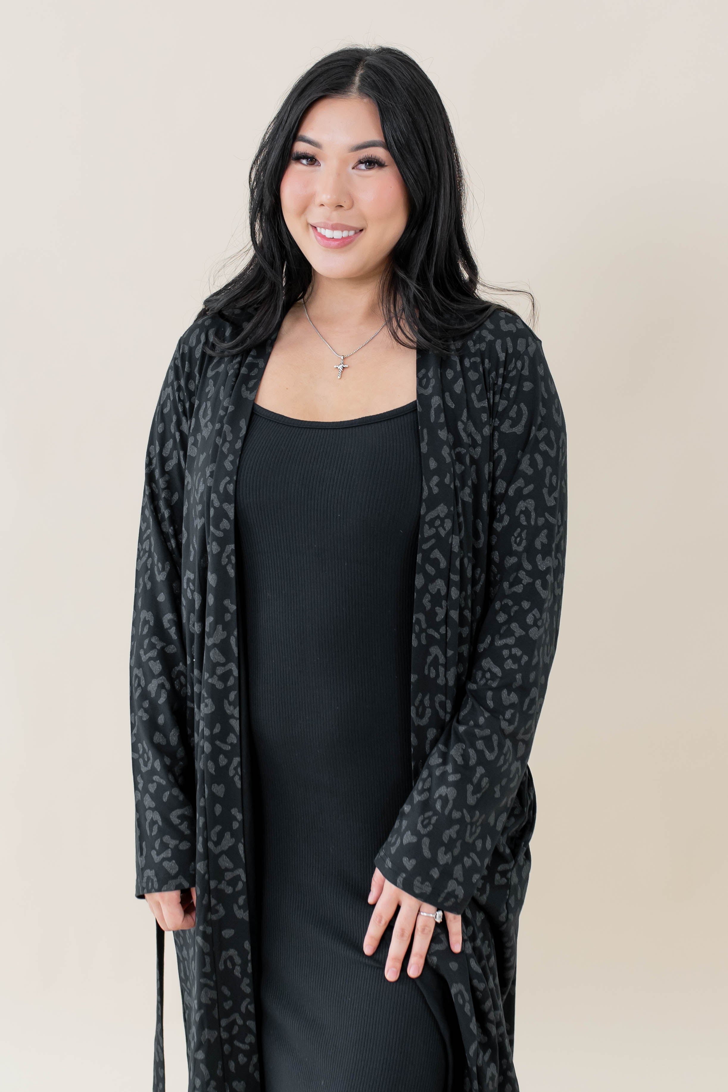 Female model wearing the Women's Lounge Robe in Midnight Leopard overtop the Women's Ribbed Cami Dress in Midnight
