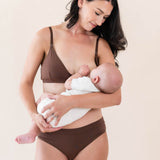 Model nursing her baby in the Women's Nursing Bra in Toffee