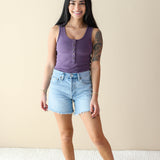 Female model wearing the Women’s Ribbed Henley Bodysuit in Currant