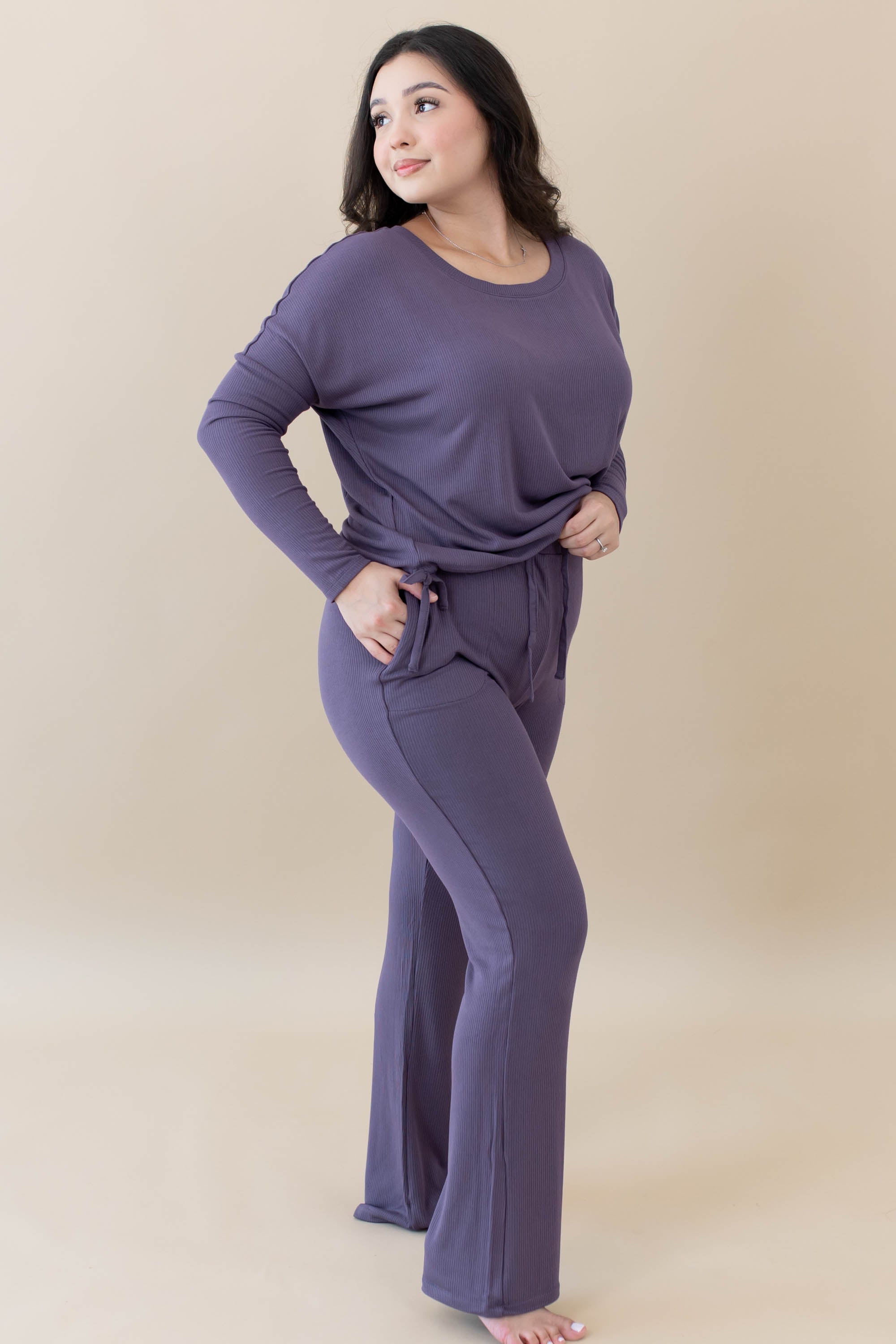 Model wearing the Women's Ribbed High Waisted Wide Leg Pant in Currant with one hand in pocket
