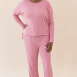 Model wearing the Women's Ribbed Long Sleeve Drop Shoulder Top in Apple Blossom paired with the Apple Blossom High Waisted Wide Leg Pant