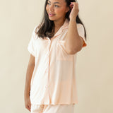 Woman modeling Women's Short Sleeve Pajama Set in Canyon holding hair back