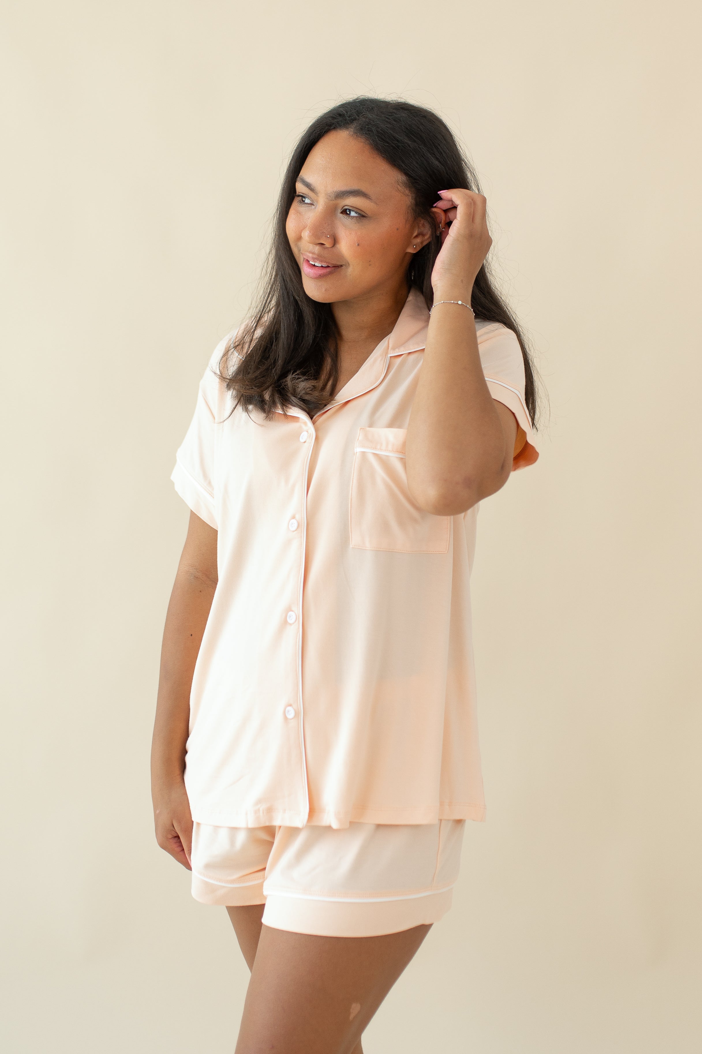 Woman modeling Women's Short Sleeve Pajama Set in Canyon holding hair back