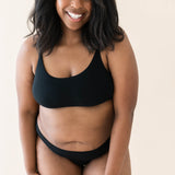 Model wearing Kyte Baby's Women's Scoop Neck Bralette in Midnight