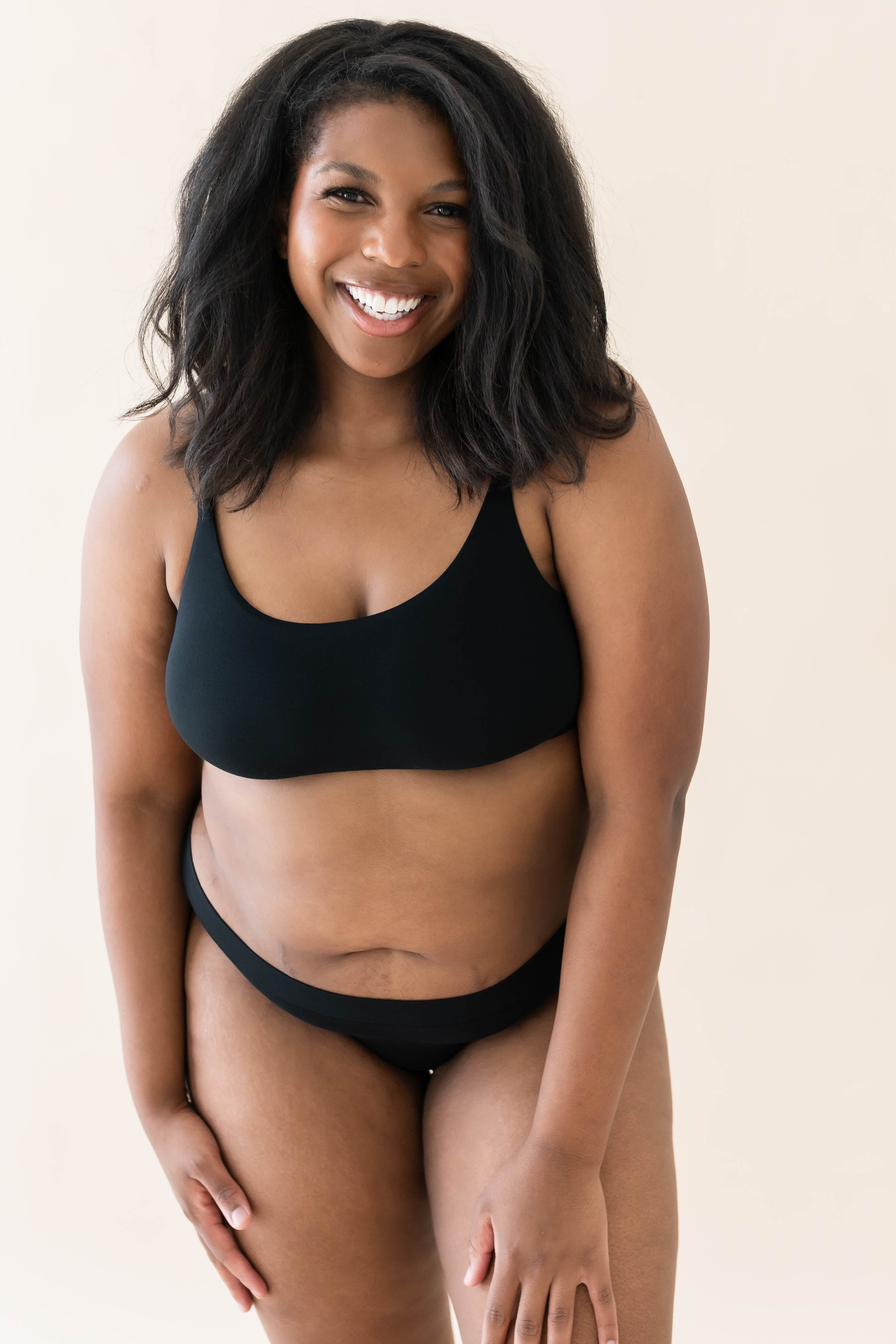 Model wearing Kyte Baby's Women's Scoop Neck Bralette in Midnight