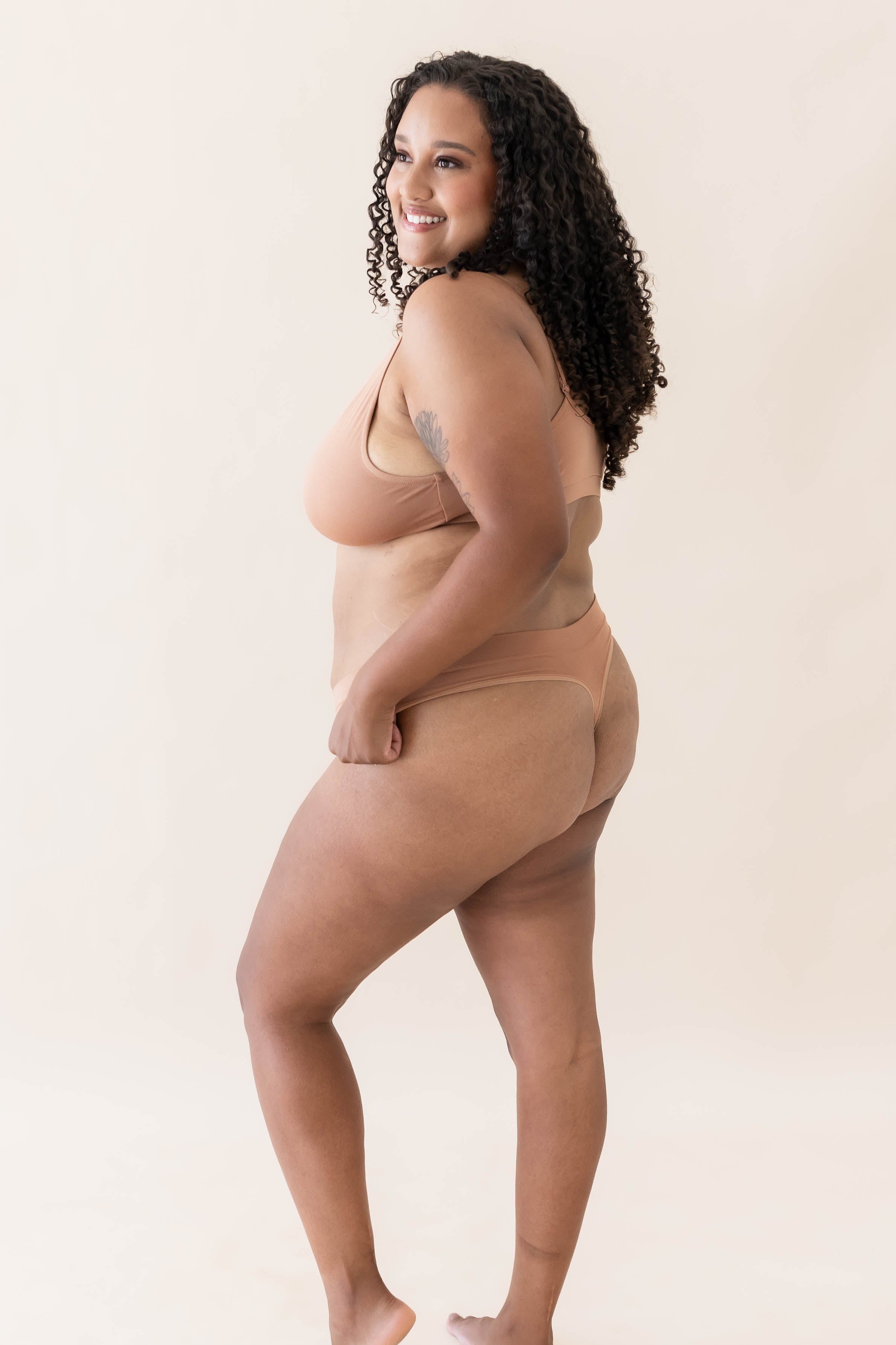 Model wearing Kyte Babys' Women's Thong in Latte
