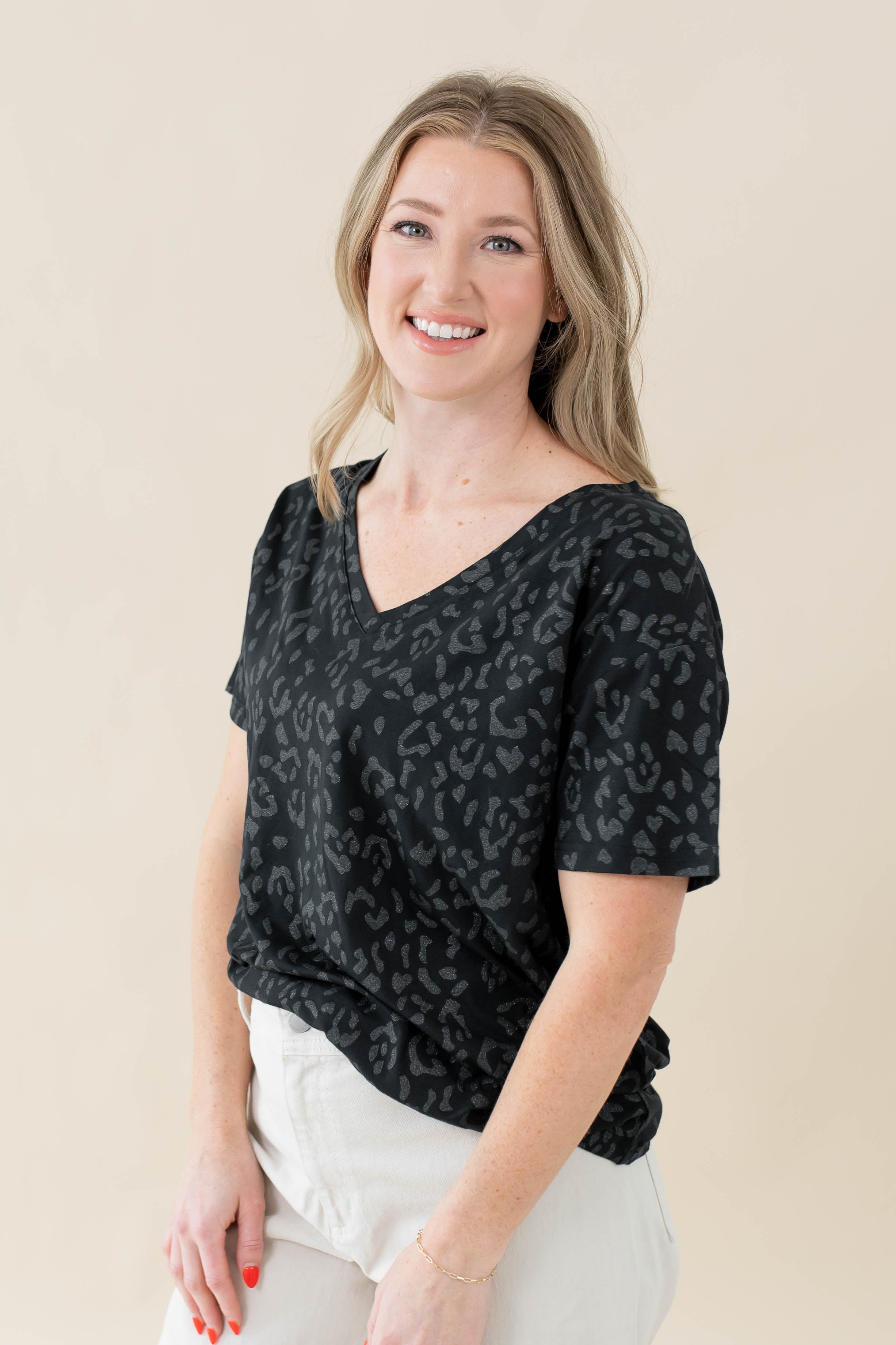Model wearing the Women's Relaxed Fit V-Neck in Midnight Leopard