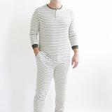 Male model wearing the Men's Ribbed Henley Set in Fir Stripe standing in front of a white backdrop