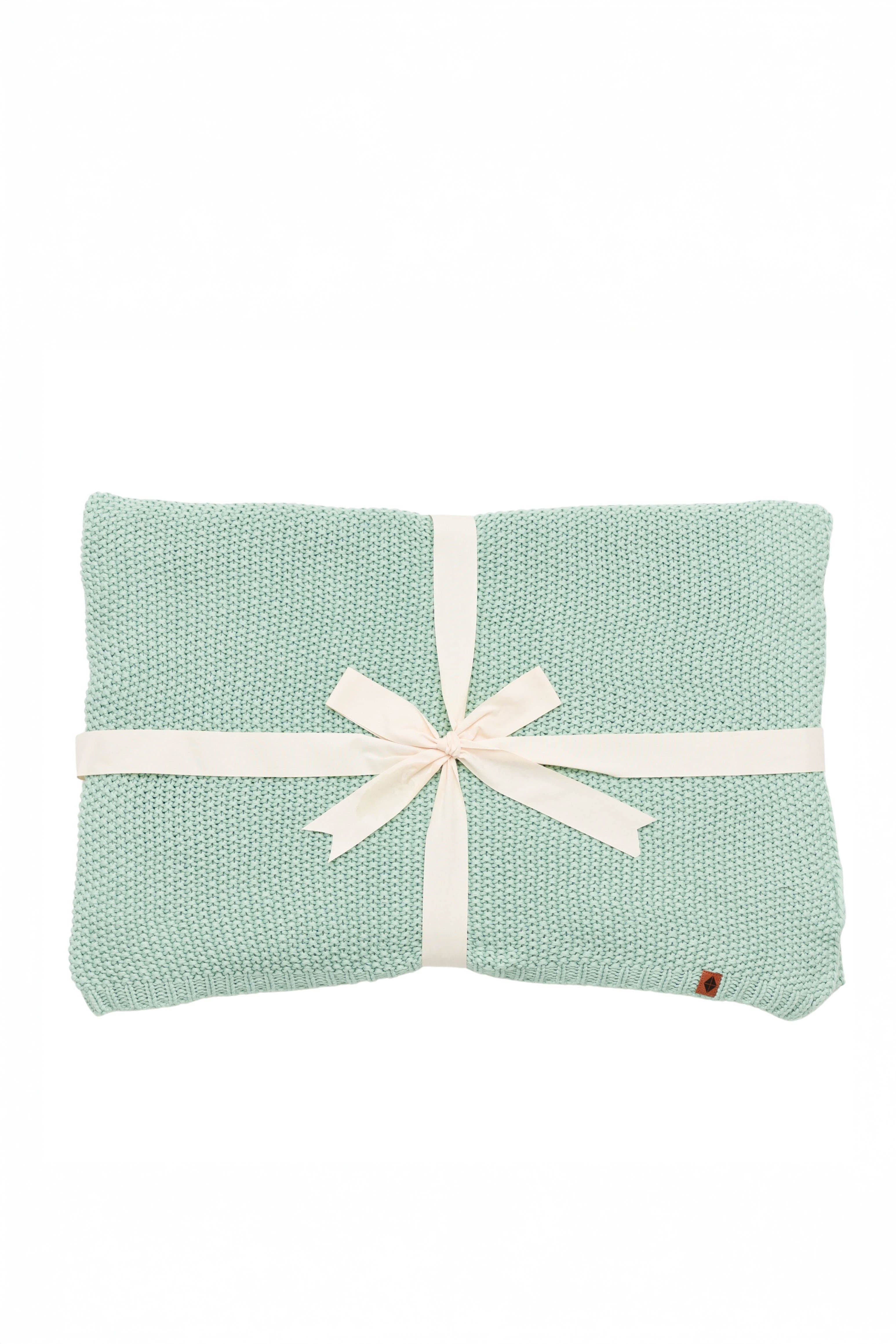 Kyte Baby's Chunky Knit Throw Blanket in Sage
