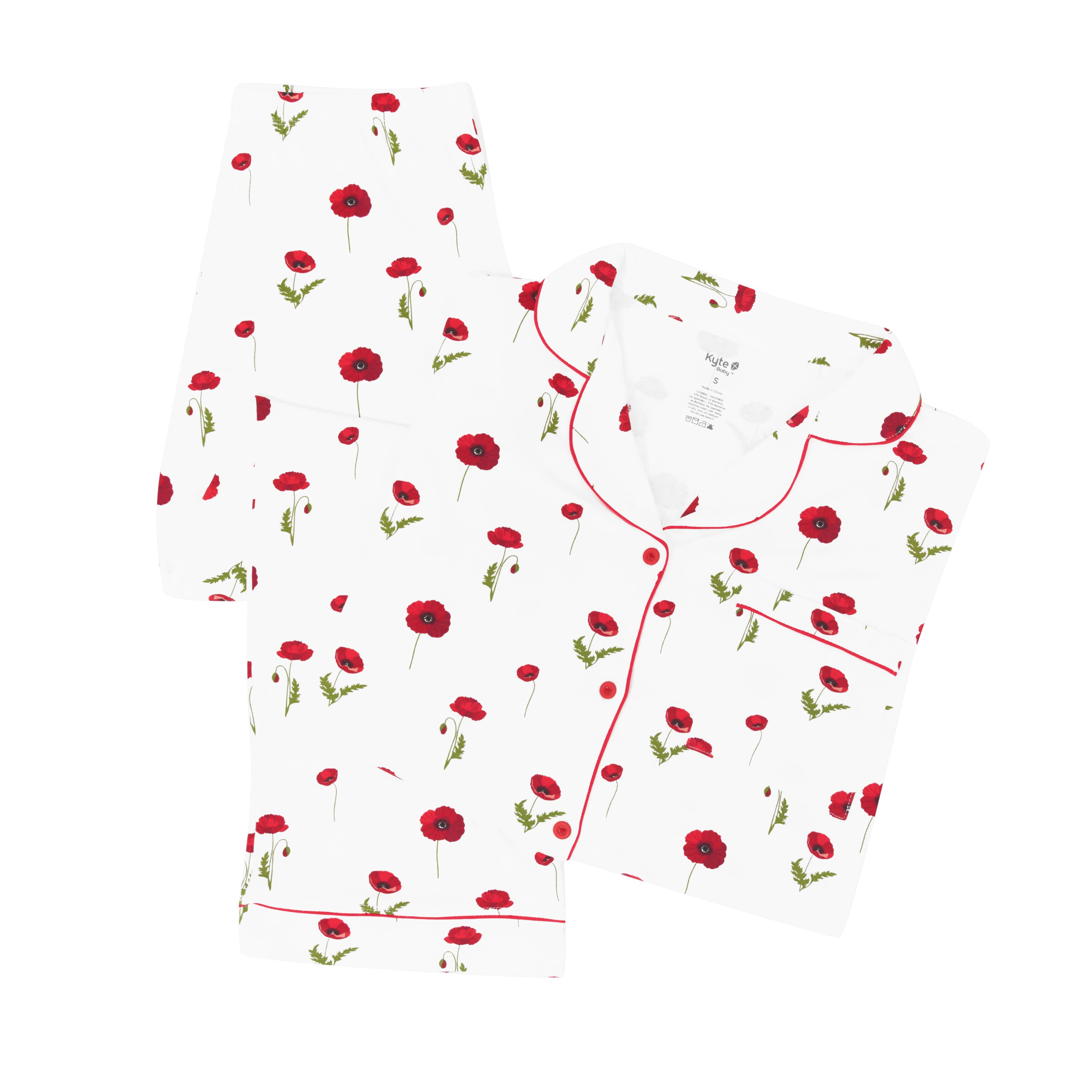 White pajamas with red floral pattern on a white background