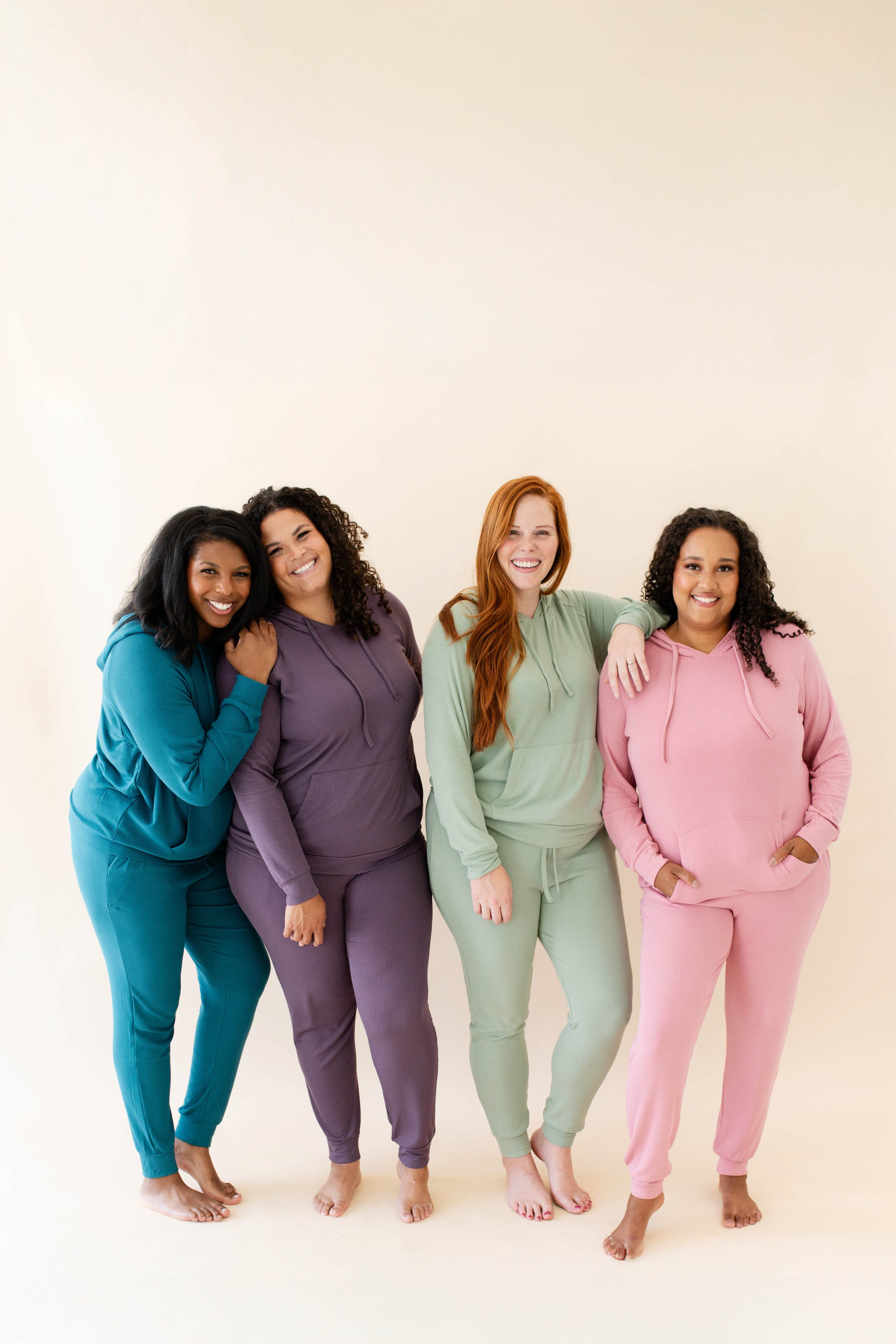 Four female models wearing various colors in the Women's Ribbed Jogger Pants