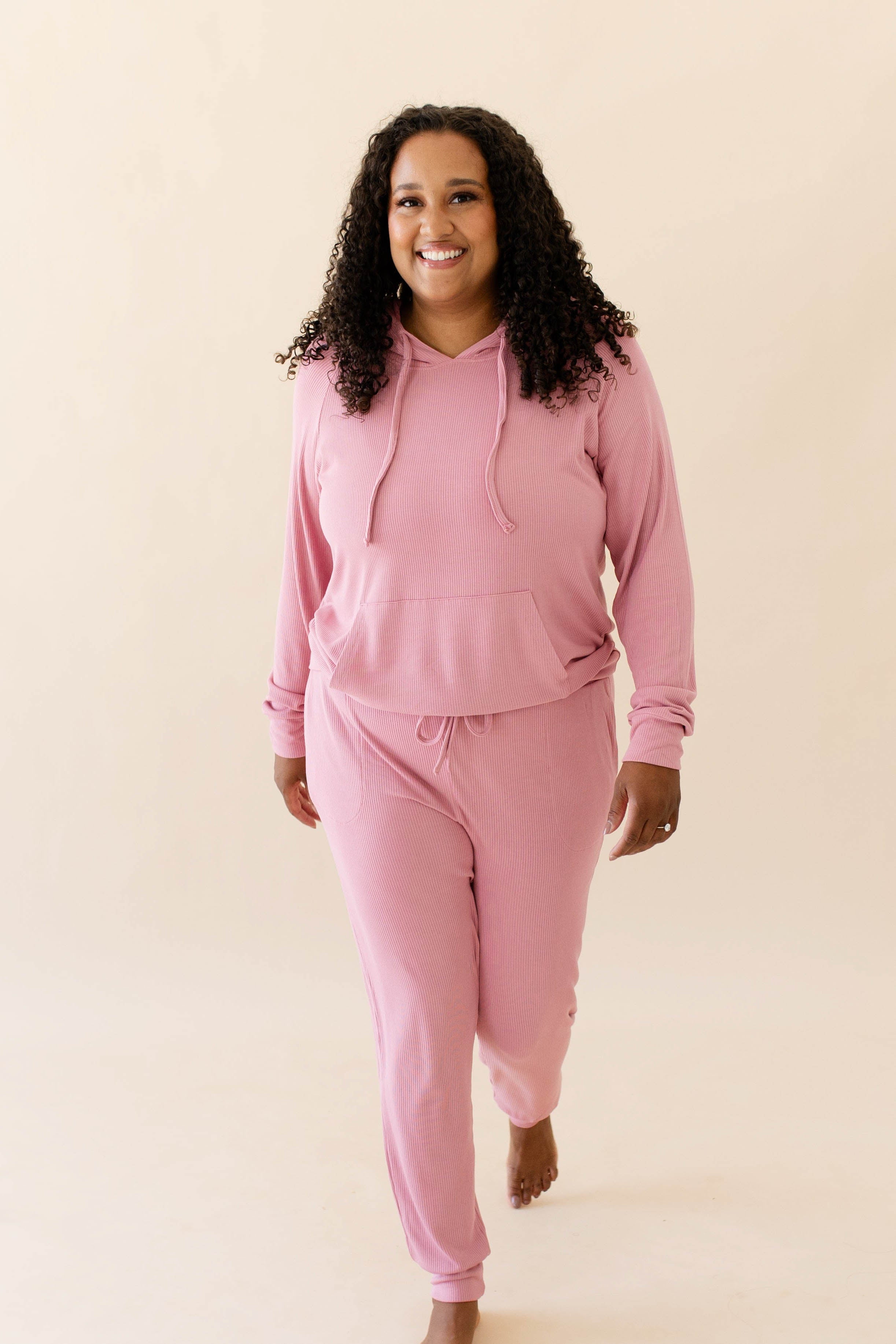 Female model in the Women's Ribbed Hoodie in Apple Blossom and Apple Blossom Jogger Pants