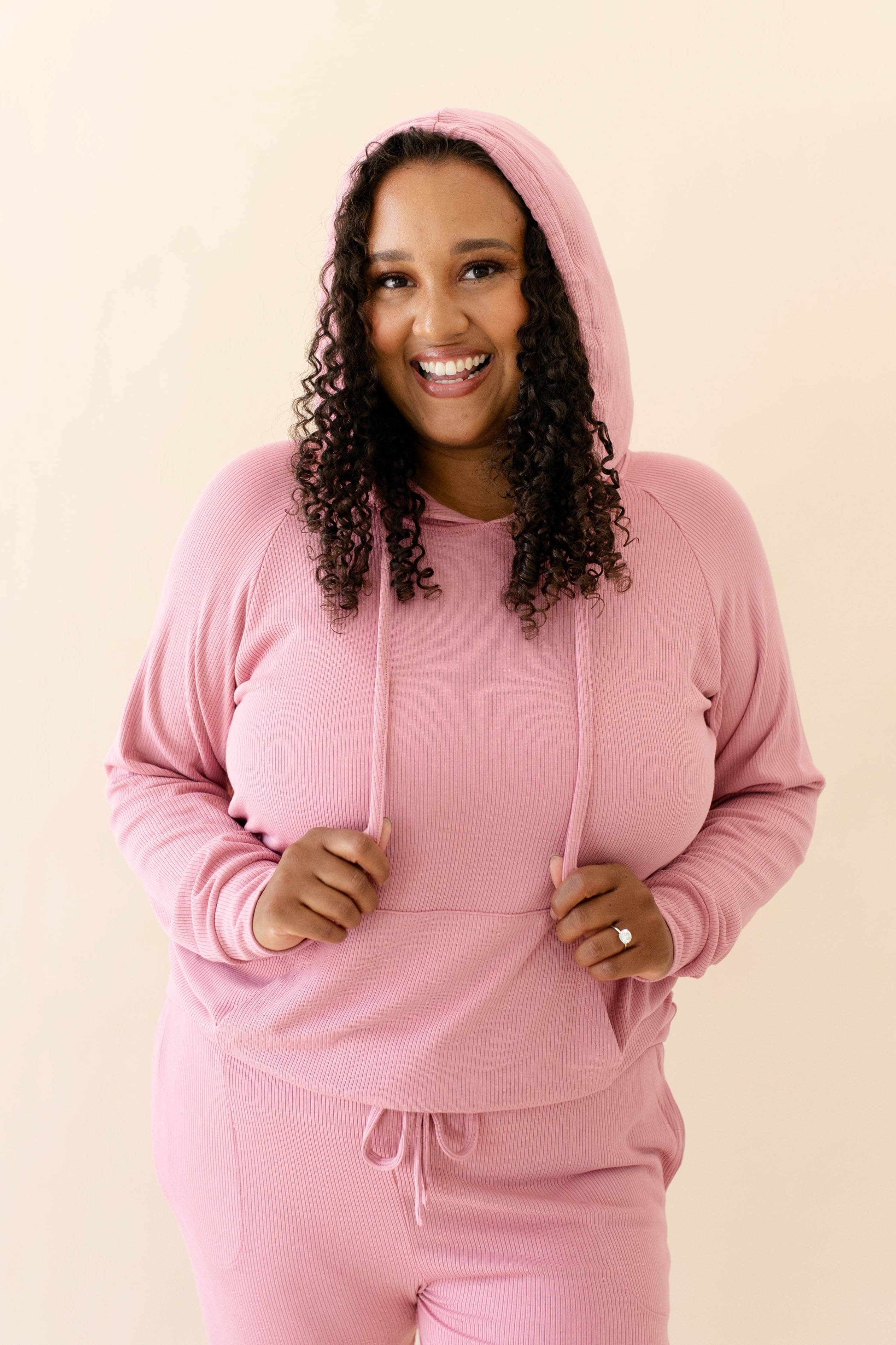 Model in the Women's Ribbed Hoodie in Apple Blossom paired with Apple Blossom Jogger Pants