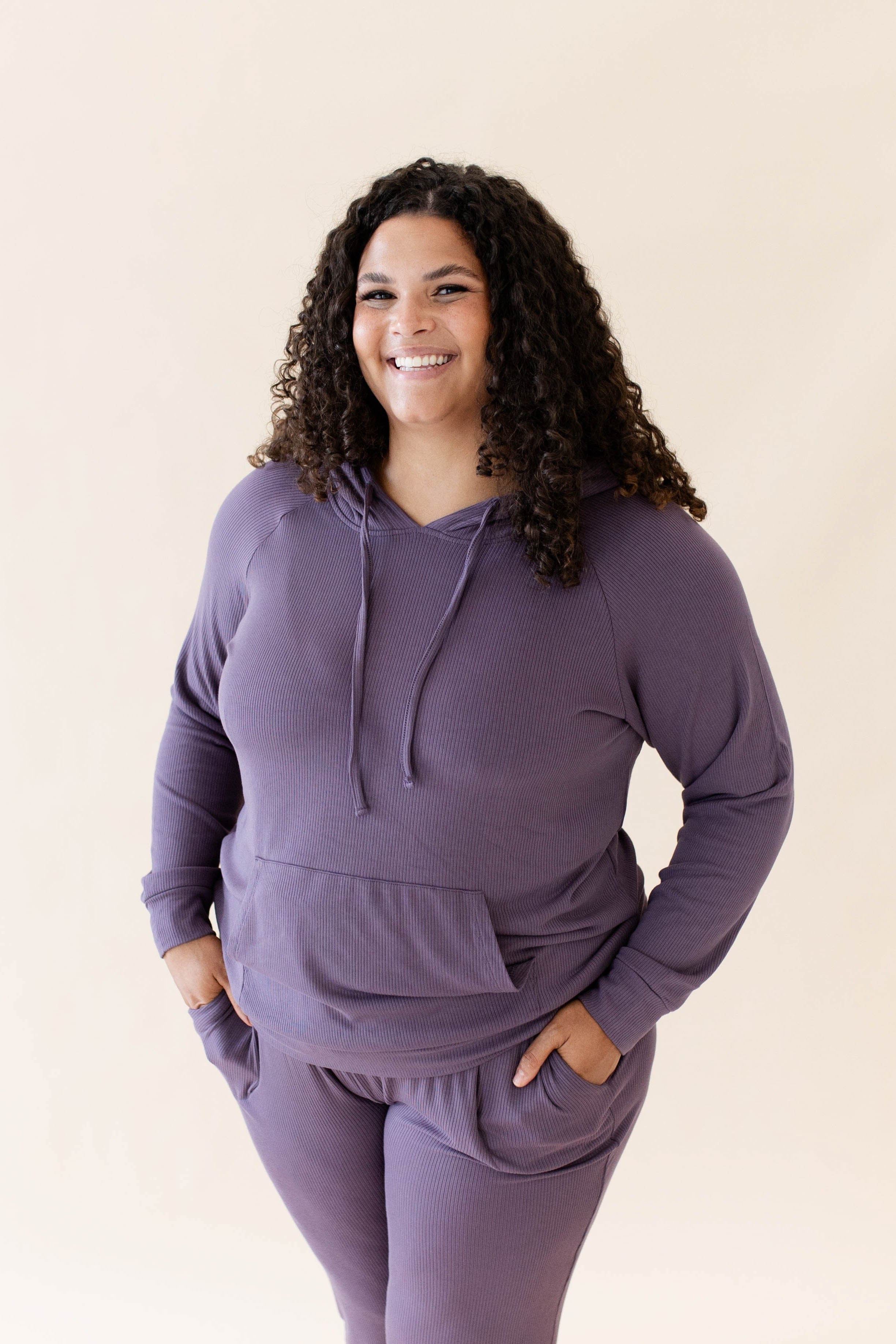 Female wearing the Women's Ribbed Hoodie in Currant paired with Women's Ribbed Jogger Pant in Currant