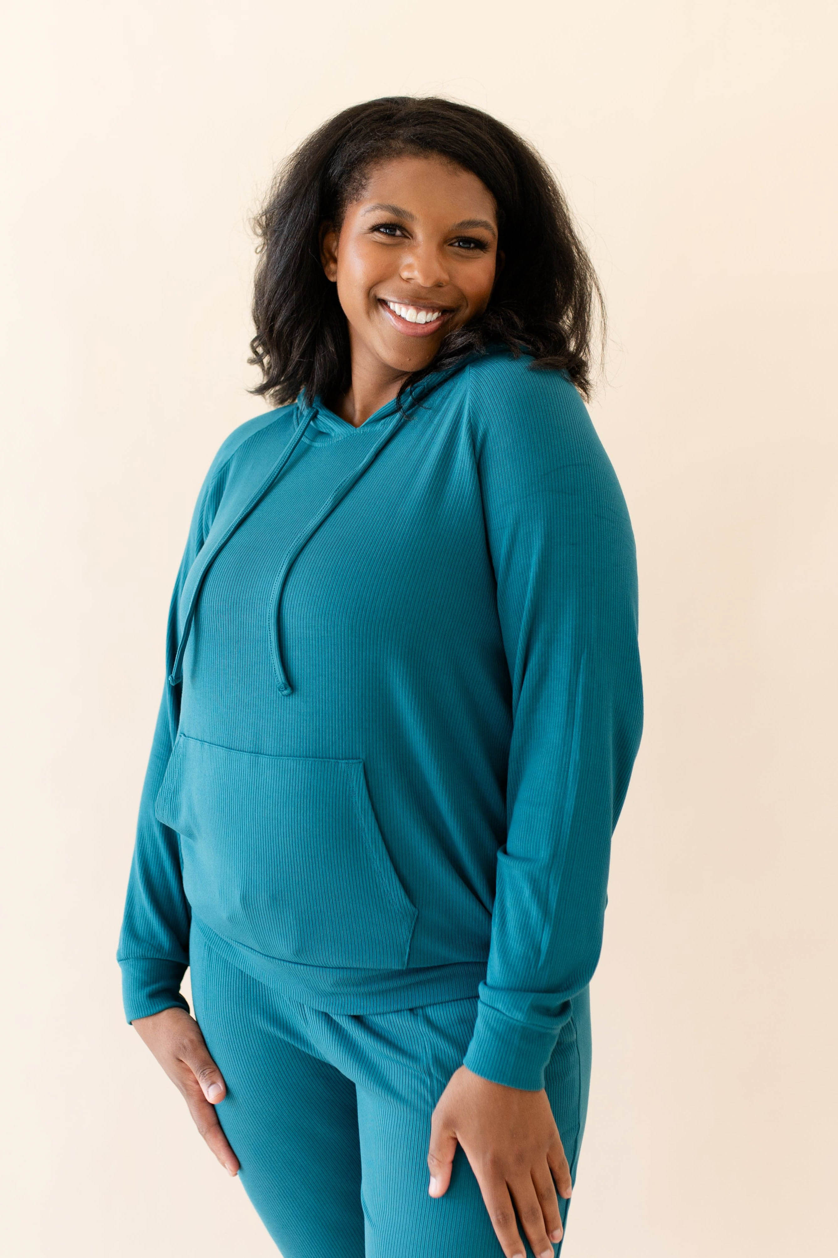 Female modeling the Women's Ribbed Hoodie in Loch paired with Loch Jogger Pants