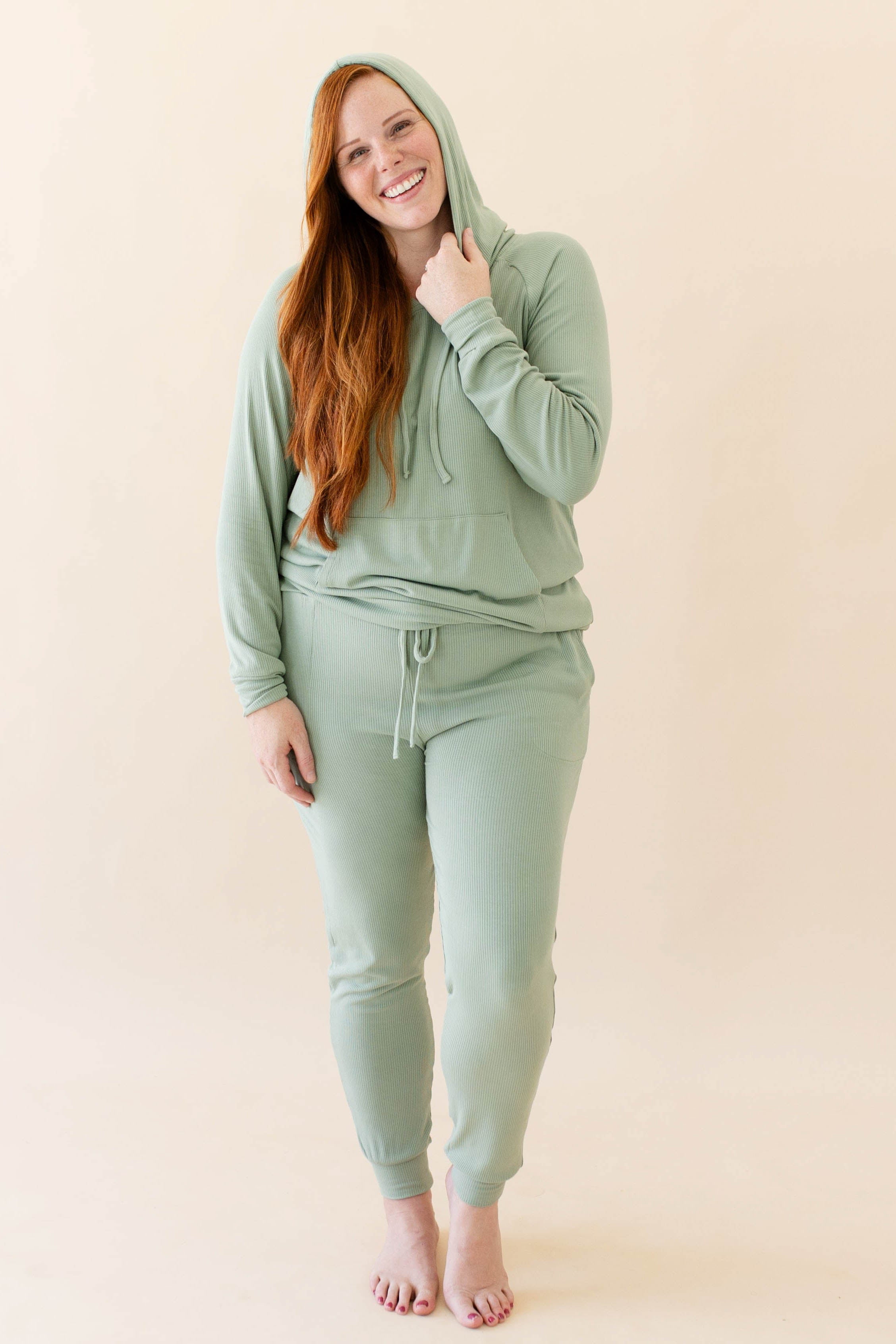 Female wearing the Women's Ribbed Hoodie in Thyme and Women's Ribbed Jogger Pant in Thyme