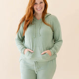 Model wearing the Women's Ribbed Hoodie in Thyme and Thyme Jogger Pants