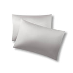 Two pillows one on top of the other with the Bamboo Sateen Pillowcases in Dove Gray on them